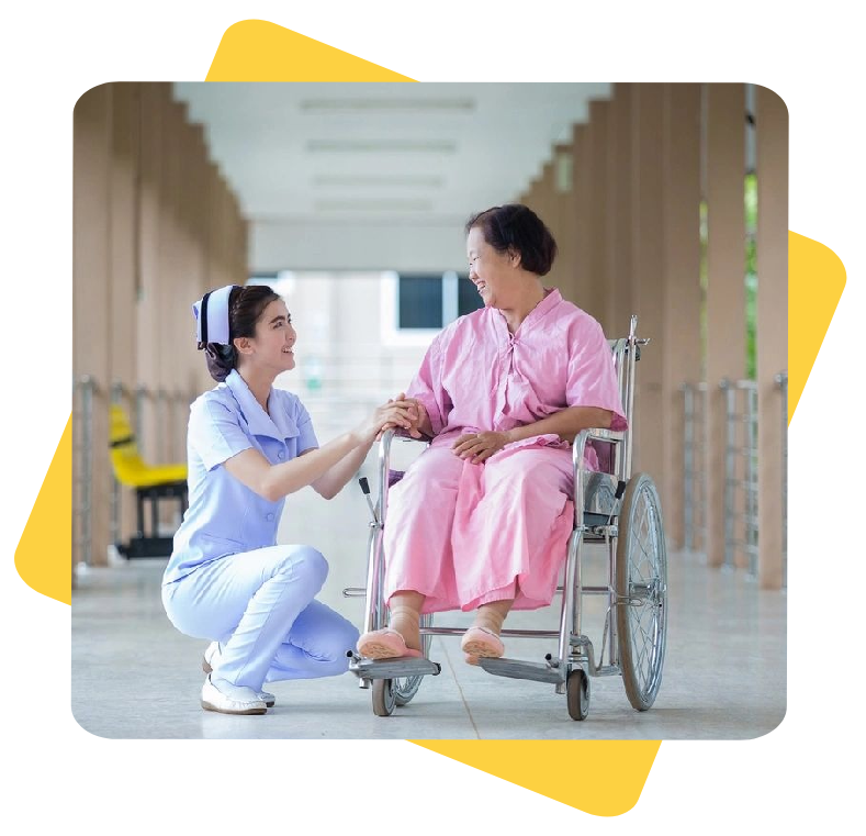 A nurse and a patient in a wheelchair.